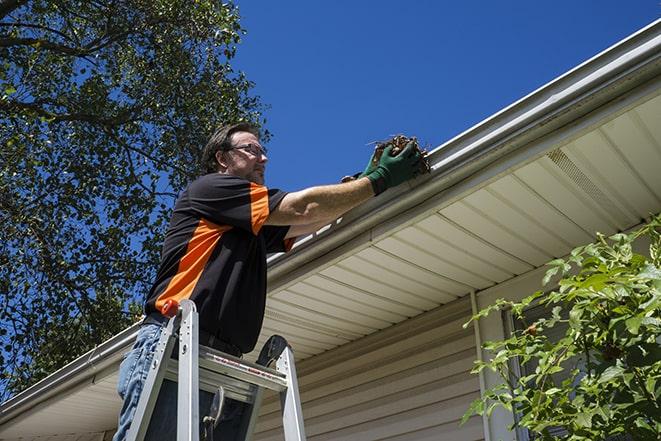 a close-up of a gutter being repaired with new materials in Christmas