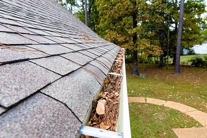 safety harness being used for gutter cleaning